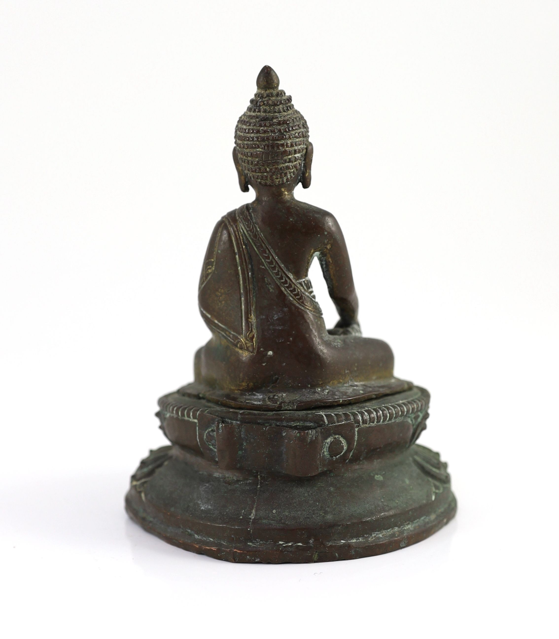 A Nepalese or Tibetan gilt copper alloy figure of Buddha Shakyamuni, 18th/19th century, 15cm high
